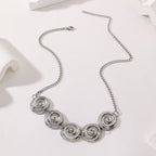 Polished Stainless Steel Round Rotating Pattern Necklace